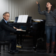 A Des Moines-area woman and rehearsal pianist Steven Chu run down "Sue Me."